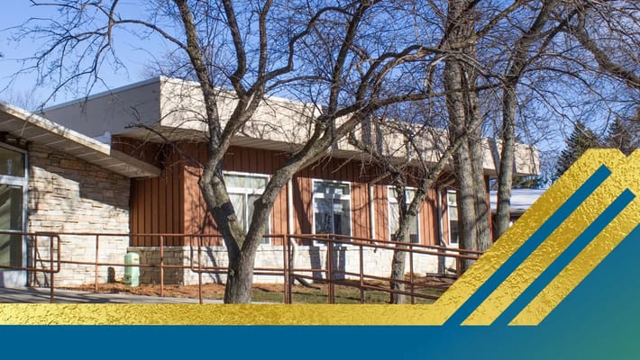 Exterior of Silver Springs Health Care Center with trees.