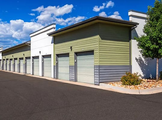 Row of garage entrances with green and white exteriors