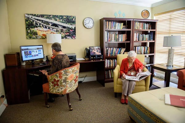 Residents enjoying a quiet moment in a cozy reading area