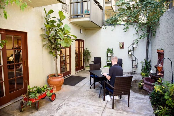 Resident enjoying the outdoor space in a courtyard