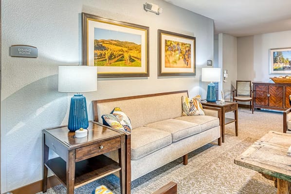 Cozy dining room with a sofa and wall art