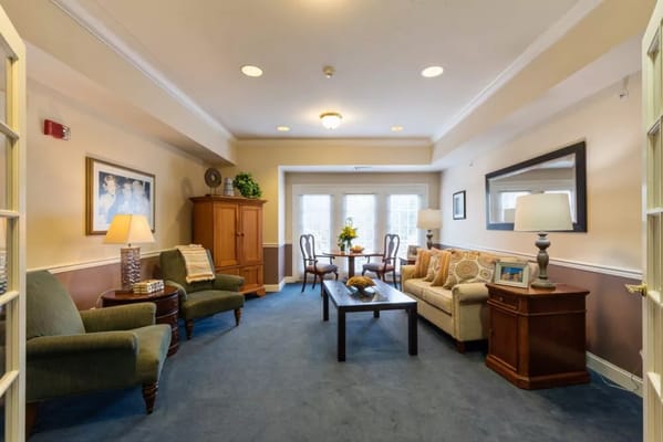 Inviting lounge with seating and a table in Somerford House.