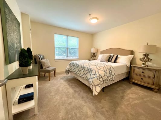 A well-furnished resident bedroom in assisted living facility