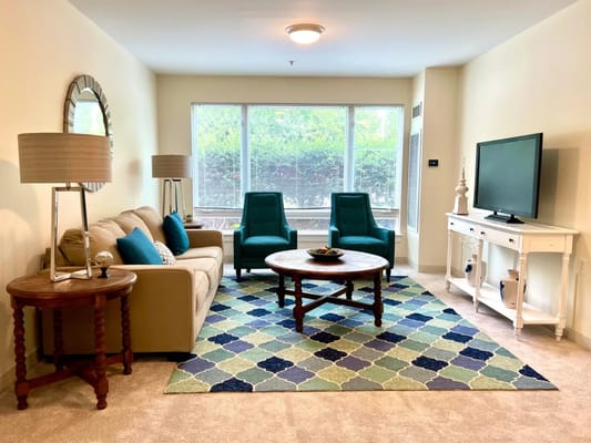 Cozy living room area with comfortable seating and natural light