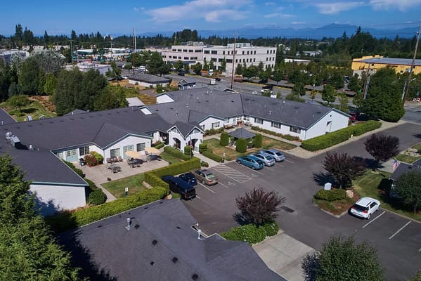 Aerial view of the South Pointe Assisted Living facility with landscaped gardens and parking.
