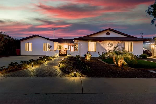 Exterior view of a senior care facility at sunset