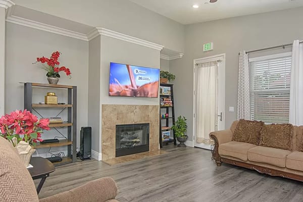 Cozy common area with seating and TV