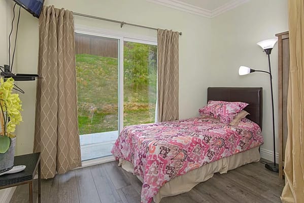 Cozy private room with a bed and natural light