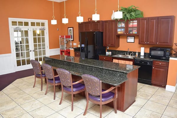 Bright common kitchen area with bar seating