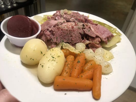 Plate of corned beef with vegetables and pickled beets