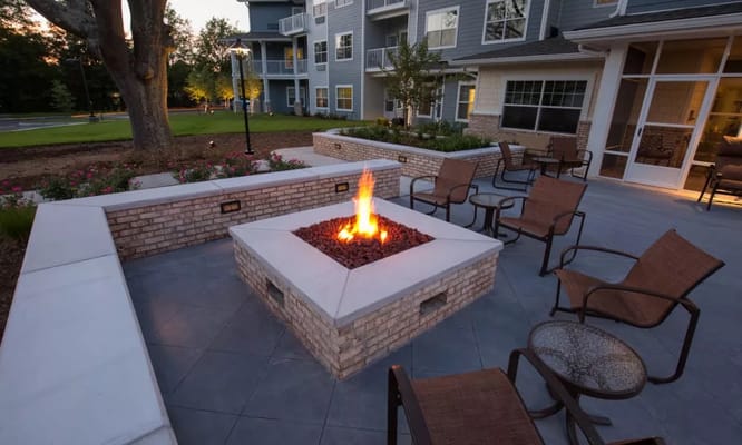 Outdoor fire pit surrounded by chairs at Springwood Landing