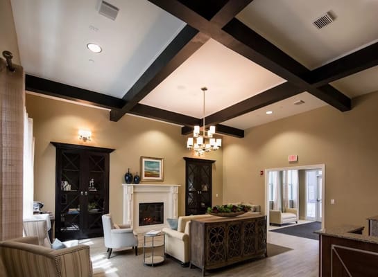 Cozy lobby area with seating and fireplace in St. Gabriel of Corpus Christi.