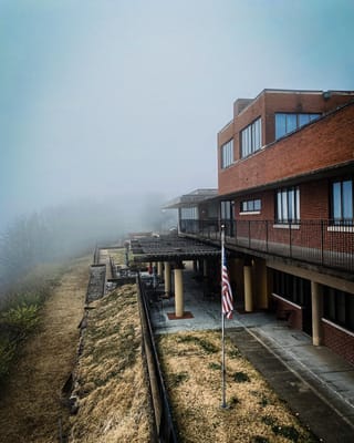 Exterior view of the facility with foggy surroundings