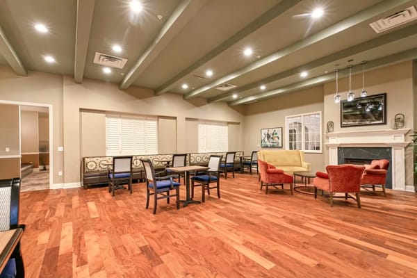 Bright and inviting common area with seating and wood flooring
