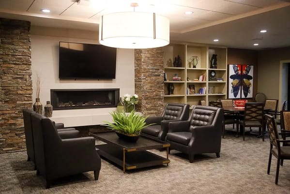 Interior lounge area featuring comfortable seating and fireplace.