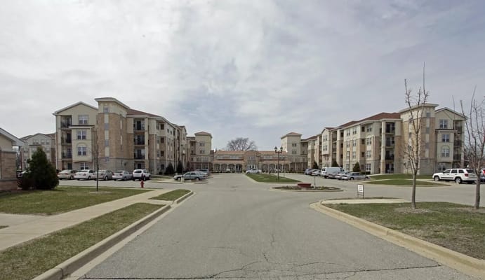 Exterior view of St. Catherine Commons with parking area