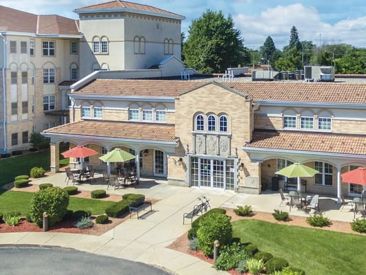 Aerial view of St. Catherine Commons with outdoor seating and colorful umbrellas.