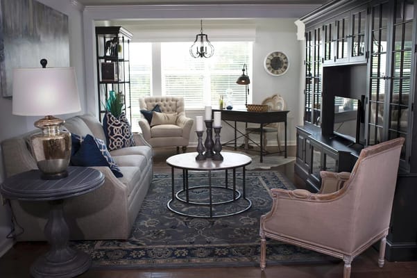 Inviting living room with comfortable seating and decorative table.