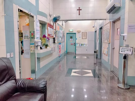 A lobby area with reception desk and informational posters