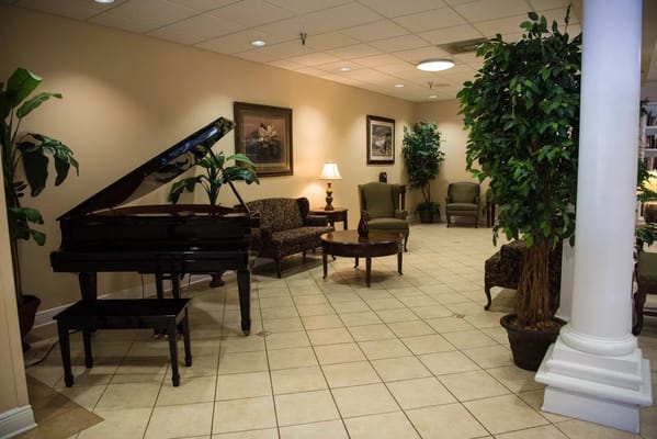 Interior lounge area with seating and piano