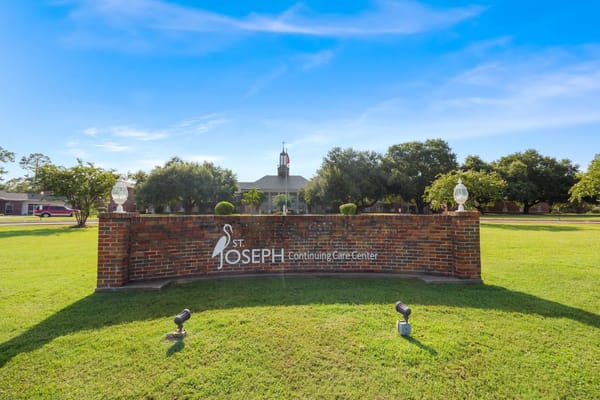 St. Joseph's Assisted Living Center sign with landscaped surroundings