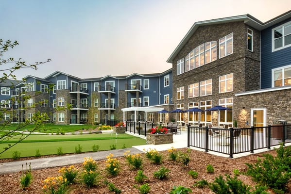Modern exterior of Stair Crest senior living facility with landscaped gardens