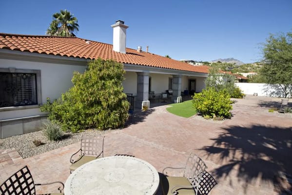 Outdoor area with gardens and seating at the facility
