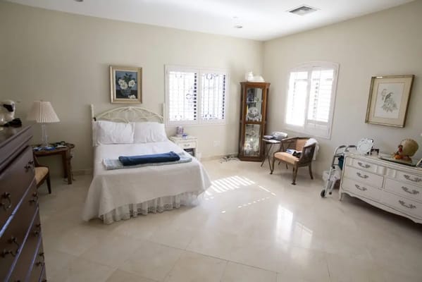 Private resident room with bed and furniture