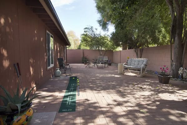 Outdoor space with seating and greenery