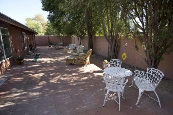 Outdoor patio area with chairs and tables
