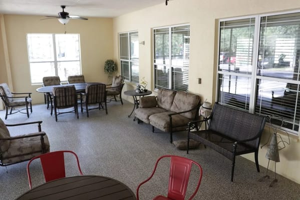 Outdoor seating area with tables and chairs