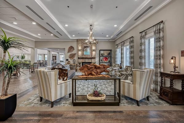 Stylish living room with comfortable seating and decor in a senior living facility