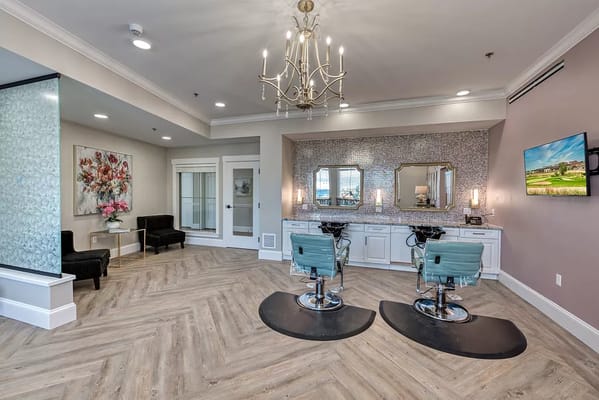 Elegant salon with two styling chairs and decorative mirrors