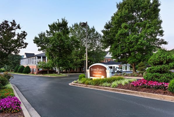 Entrance of StoryPoint Chattanooga with landscaped gardens and sign