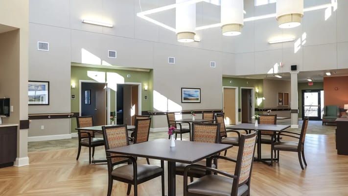 Bright dining area with tables and chairs at Stratford Commons