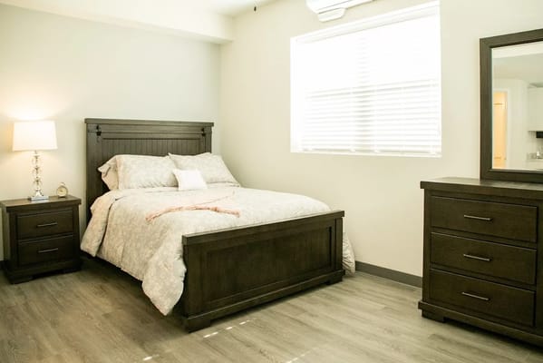Comfortable resident bedroom with natural light