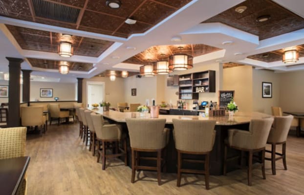 Interior view of a stylish bar area with seating