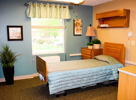 Cozy resident room with a bed and window view