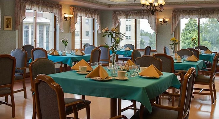 Bright dining area with teal tables and chairs