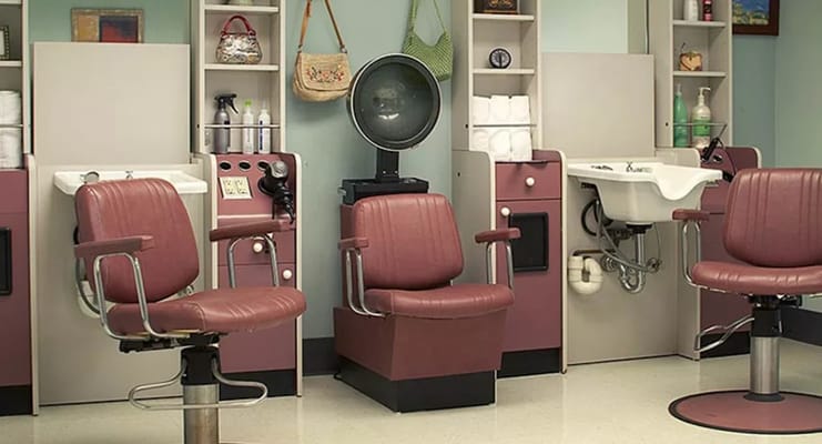 Salon with styling chairs and shampoo station