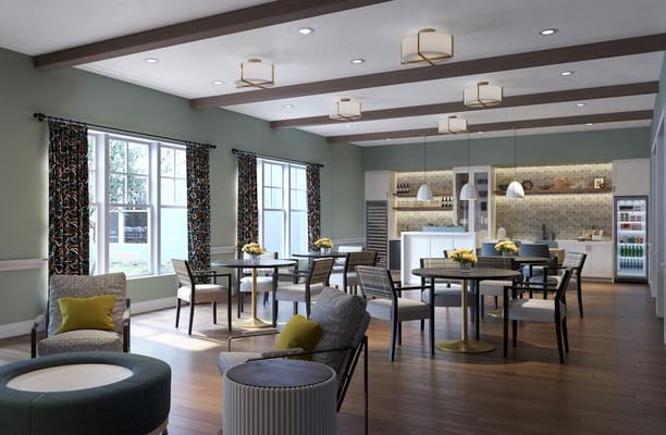 Bright and inviting common area with dining tables