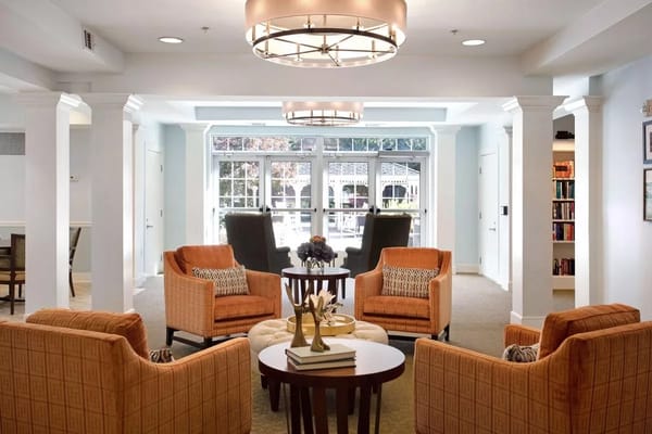 Bright common area with cozy seating and natural light