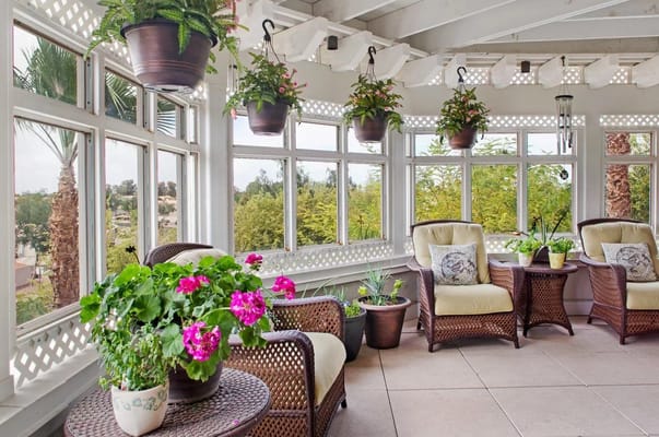 Bright indoor seating area with plants and flowers
