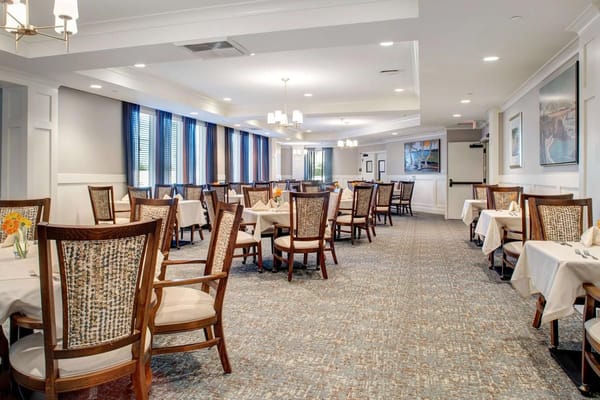 Interior view of the dining room with tables and chairs