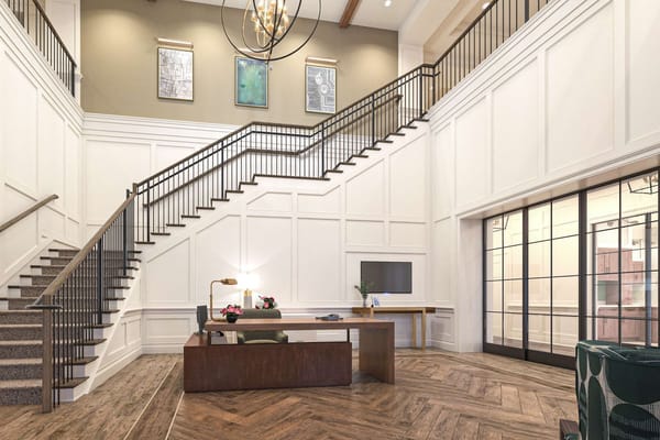 Spacious lobby with staircase and reception desk