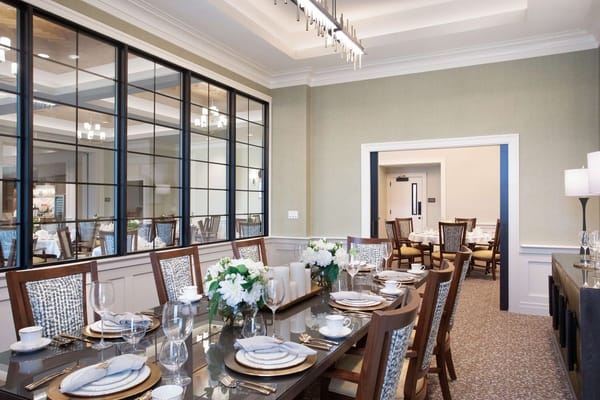 Elegant dining setup with floral arrangements in the dining room.