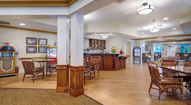Bright and spacious lounge area with tables and seating