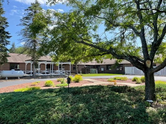 Exterior view of Suring Health and Rehabilitation Center with landscaping