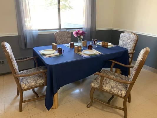 Dining table set for a meal in an interior space