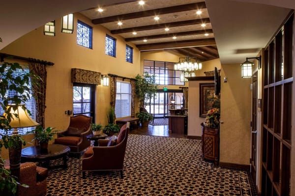 Cozy lobby area with seating and decorative lighting